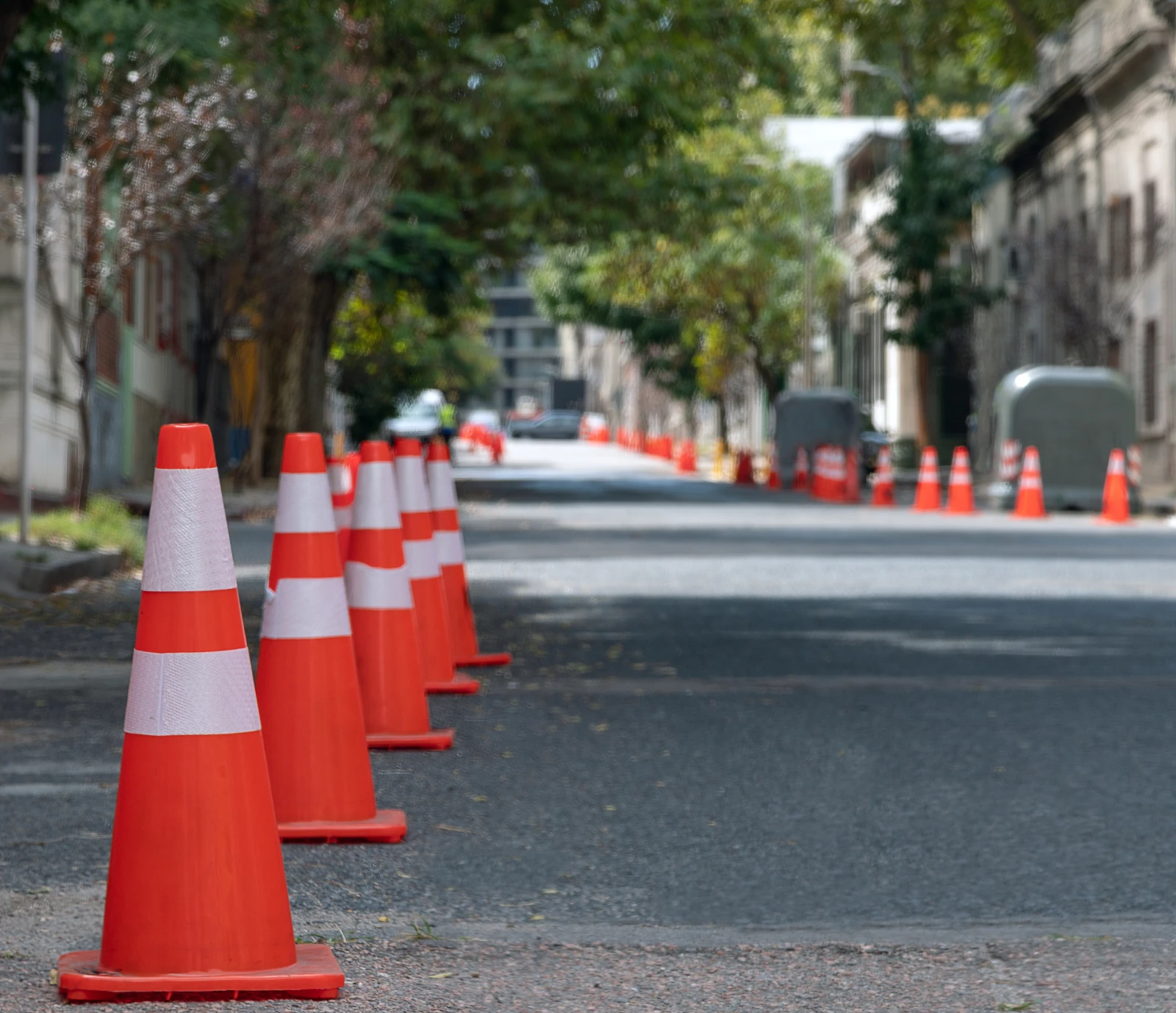 Orange traffic cones lining a street